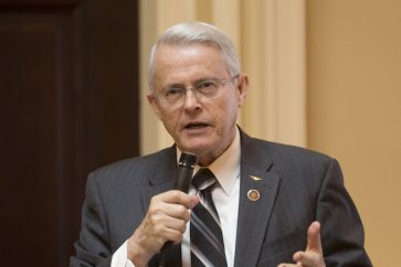 State Sen. Richard Black, R-Loudon, gestures during a debate on the floor of the Senate during the session at the Capitol in Richmond, Va., Tuesday, Feb. 2, 2016. (AP Photo/Steve Helber)